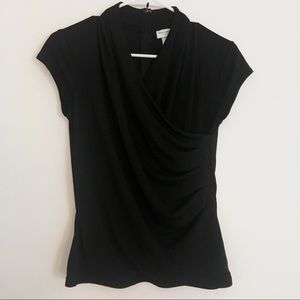 Classy black V-neck top with flattering trim.